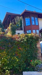 A house with a car parked in front of it