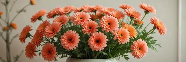 Delicate pink ceramic vase containing an abundance of orange-tinted chrysanthemums and lush green stems, ceramic, orange flowers, flower arrangement