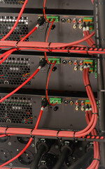Connecting multimedia equipment in a telecommunications rack.
