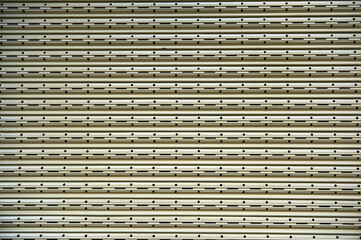 Metal blinds with shelves with circular and rectangular perforations