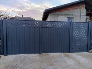 Fototapeta premium A metal gate with a decorative design on it