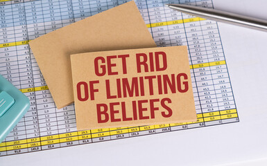 GET RID OF LIMITING BELIEFS, TEXT on notepad and white background with document folder