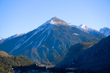 Scenic rural landscape at Albula Valley seen from mountain village of Brienz on a sunny autumn day. Photo taken November 15th, 2024, Brienz Brinzauls Albula, Switzerland.