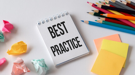 Best practice text on white sticky note on white background.