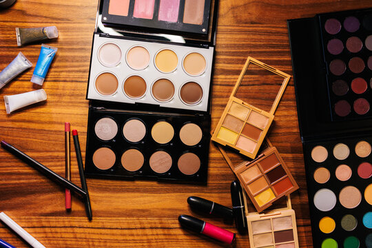 Makeup products on a wooden table
