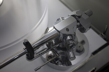 the tonearm of vinyl record player close-up