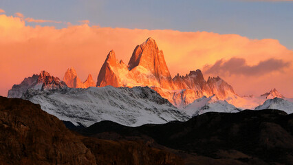 Fototapeta premium Mountains in Patagonia illuminated by red light at sunrise