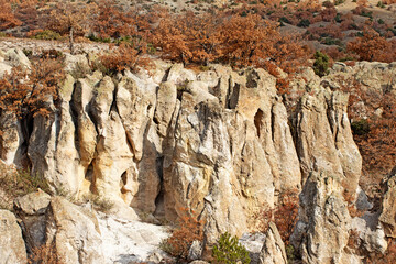 An autumnal vew of the fairy chimneys, rock formations by the side of road to Avdalaz Castle in the north of Ayazini village in Afyonkarahisar province in western Anatolia region of Turkey