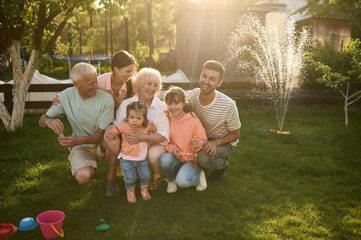 Portrait of large family playing on a backyard