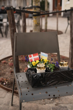 Flowers and candles on chair in Vejle, Denmark
