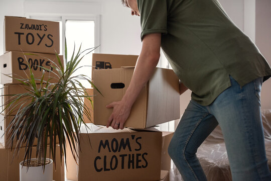 Man bringing boxes to new apartment