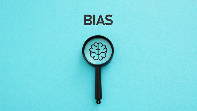 Bias and Mental Health. magnifying glass with a representation of the brain