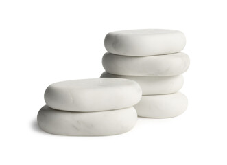Many stacked spa stones isolated on white