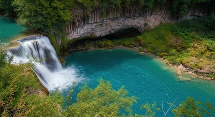 Fototapeta premium Enchanting waterfall in lush oasis