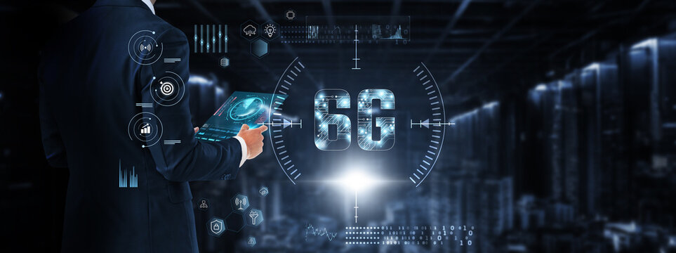6G Technology: Businessman control and monitoring 6G technology system on digital screen. Ultra-low latency, high-speed connectivity, AI integration, smart networks, real-time data processing.