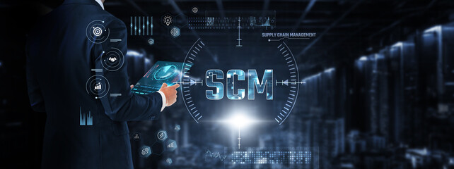 Supply chain management (SCM): Businessman control and monitoring SCM technology system on a digital screen. Inventory management, logistics, demand forecasting, procurement, distribution, tracking.