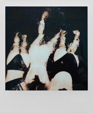 Three Women&rsquo;s Backsides During a Night Swim