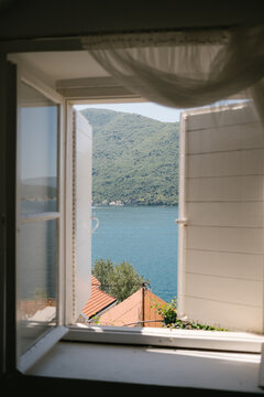 View of the Mediterranean sea through an open window