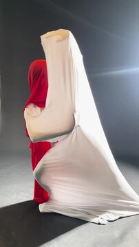 Elegant ballet dance rehearsal backstage with creative fabric movement