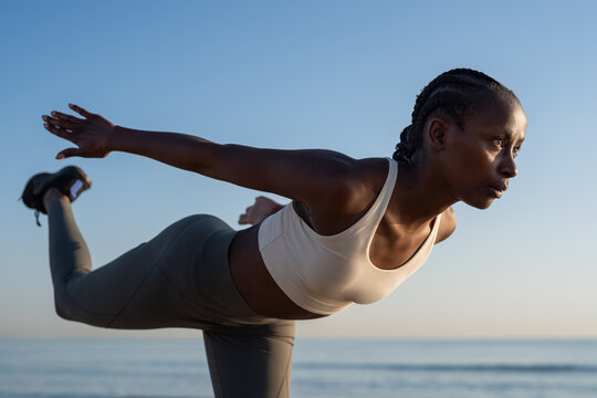 Determined woman exercising at beach