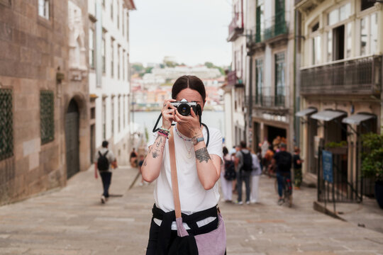 A young woman taking a photo