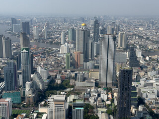 A cityscape with tall buildings and a clear blue sky