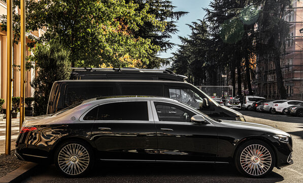 BATUMI, GEORGIA - NOVEMBER 29, 2024: Mercedes Maybach Haute Voiture. Black Mercedes S580 parked on the side of the road near casino or luxury 5 five stars Hotel. Side view with car.  S Class. street