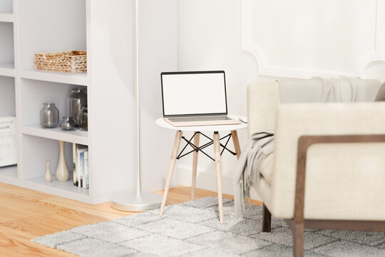 Laptop with blank screen screen in living room. Mock up