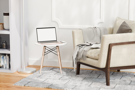 Laptop with blank screen screen in living room. Mock up