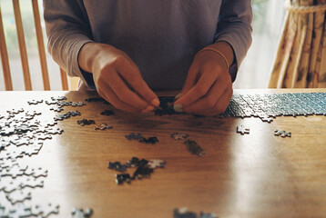 A girl doing a jigsaw puzzle