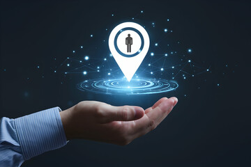 Hand holds digital location marker, suggesting modern location based services