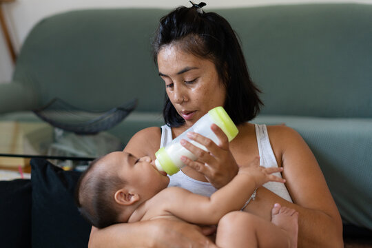 A mother feeds her baby 