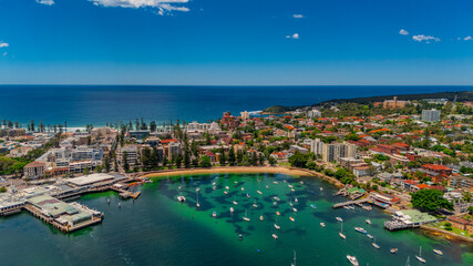Obraz premium Aerial View of Manly Beach and Sydney harbour with manly houses on a warm summer day blue skies Sydney NSW Australia