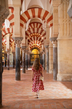 Woman walking inside of the Great Mosque of Cordoba