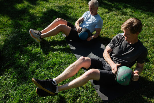 Candid Moment of Friends Exercising Outdoors in Summer