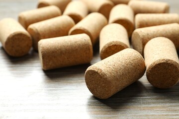 Wine corks on wooden background 