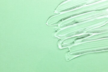 Smear of cream and gel on a colored background