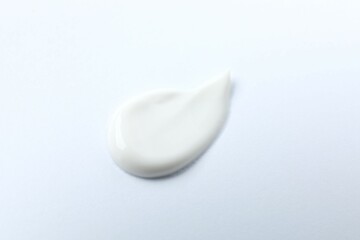 Smear of cream on a white background