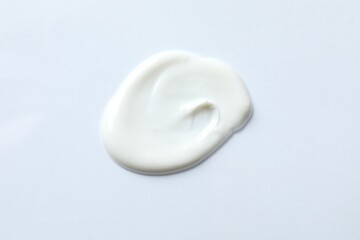 Smear of cream on a white background