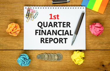1st quarter financial report symbol. Concept words 1st quarter financial report on beautiful white note. Beautiful wooden background. Business 1st quarter financial report concept. Copy space.
