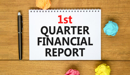 Fototapeta premium 1st quarter financial report symbol. Concept words 1st quarter financial report on beautiful white note. Beautiful wooden background. Business 1st quarter financial report concept. Copy space.