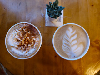 Two cup of coffee on the wood table