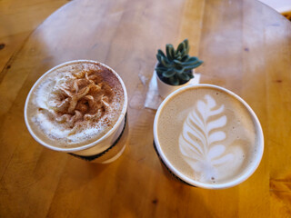 Two cup of coffee on the wood table. Coffee break