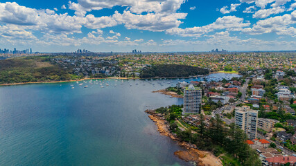 Fototapeta premium Aerial View of Manly Beach and Sydney harbour with manly houses on a warm summer day blue skies Sydney NSW Australia