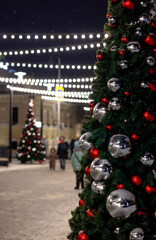 Fototapeta premium Christmas tree with decorations on the right. Postcard