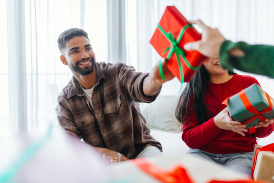Handsome man receiving Christmas gift