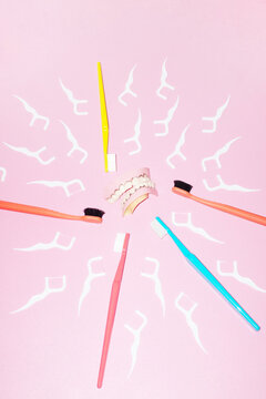 Teeth and colourful oral health hygiene toothbrushes with flashlight