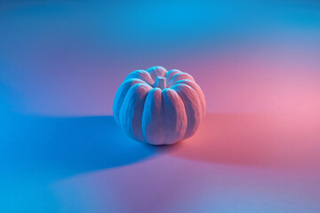 Artificial pumpkin with minimalistic design standing at studio
