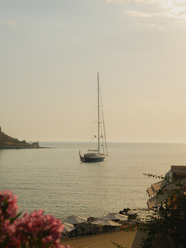 A yacht sailing towards the shore in Greece
