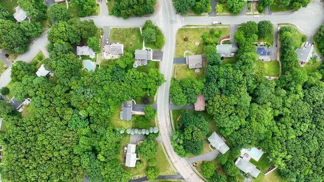 Aerial view of Suburban neighborhood in Sharon, Norfolk County, Massachusetts, with green forest and big villa.